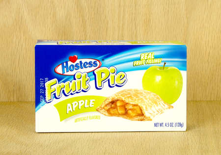 RIVER FALLS,WISCONSIN-AUGUST 30,2017: A Hostess brand apple pie box with a wood background.のeditorial素材