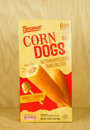 RIVER FALLS,WISCONSIN-AUGUST 31,2017: A box of Bremmer brand chicken corn dogs with a wood background.のeditorial素材