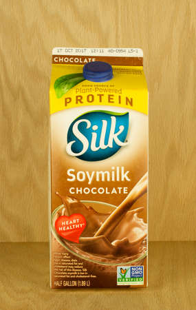 RIVER FALLS,WISCONSIN-SEPTEMBER 02,2017: A carton of Silk brand soy milk with a wood background.のeditorial素材
