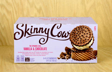 RIVER FALLS,WISCONSIN-SEPTEMBER 03,2017: A box of Skinny Cow brand ice cream sandwiches with a wood background.のeditorial素材