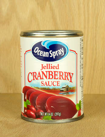 RIVER FALLS,WISCONSIN-SEPTEMBER 05,2017: A can of Ocean Spray brand cranberry sauce with a wood background.のeditorial素材
