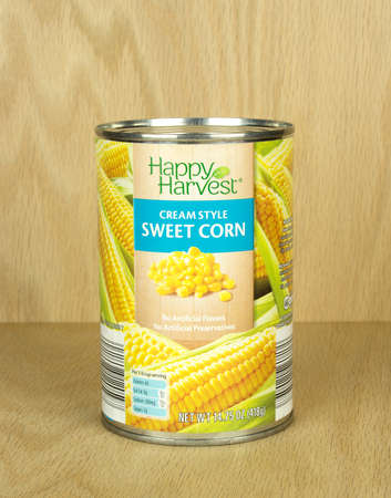 RIVER FALLS,WISCONSIN-SEPTEMBER 08,2017: A can of Happy Harvest brand creamed sweet corn with a wood background.のeditorial素材