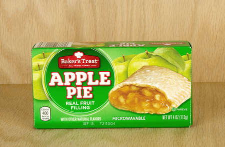 RIVER FALLS,WISCONSIN-SEPTEMBER 17,2017: A Baker's Treat brand apple pie box with a wood background.のeditorial素材