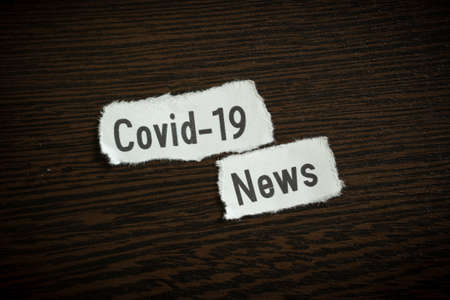 Covid-19 news - Scrap pieces of paperの写真素材
