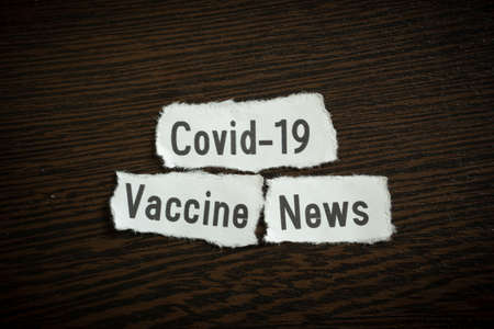 Covid-19 vaccine news - Scrap pieces of paperの写真素材