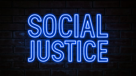 Social Justice - blue neon light word on brick wall backgroundの写真素材