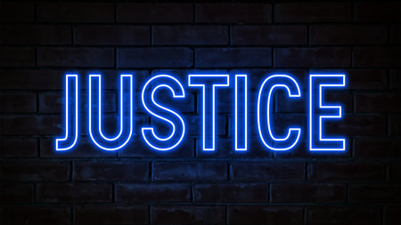 Justice - blue neon light word on brick wall backgroundの写真素材
