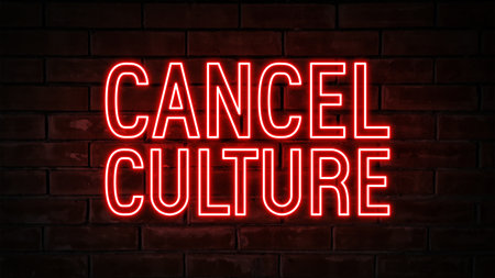 Cancel culture - red neon light word on brick wall backgroundの写真素材