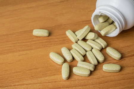 Bottle and pills on the tableの写真素材