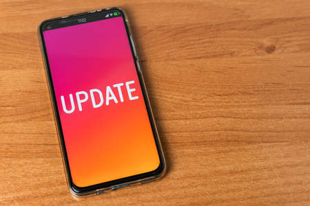 Update word - Phone on tableの写真素材
