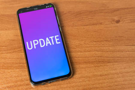 Update - Phone on tableの写真素材