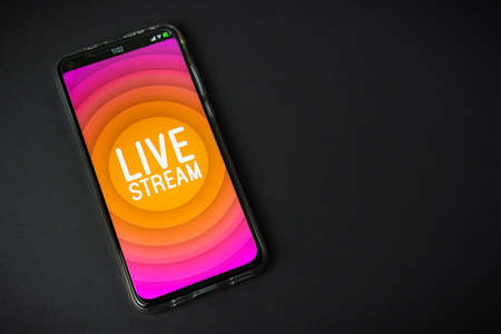 Phone with Live stream   on black backgroundの写真素材