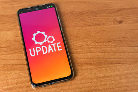 Update - Phone on tableの写真素材
