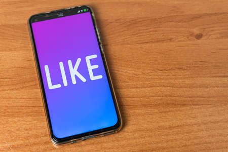 Like - Phone on tableの写真素材
