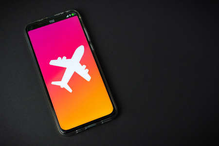 Phone with airplane symbolの写真素材