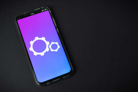 Update - Phone on black backgroundの写真素材
