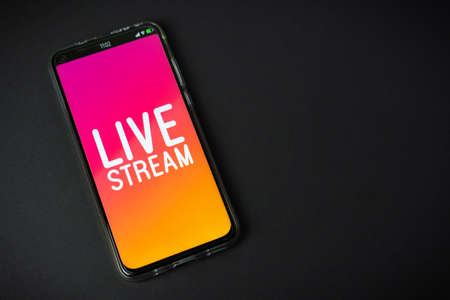 Phone with Live stream   on black backgroundの写真素材