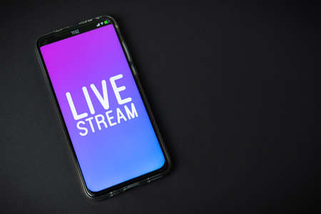 Phone with Live stream   on black backgroundの写真素材