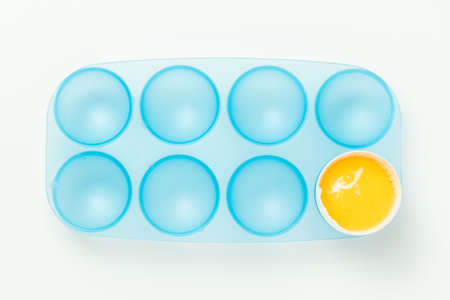 One broken egg with yolkの写真素材