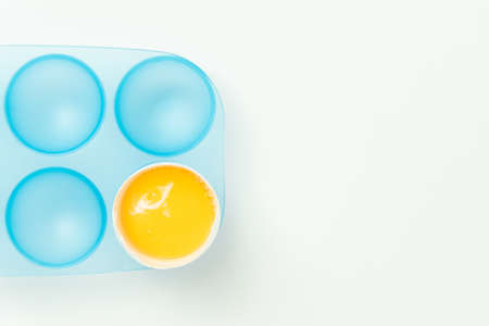One broken egg with yolkの写真素材