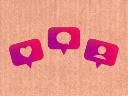 Like, comment, follower icons on cardboard textureの写真素材