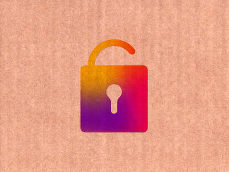 open lock icon on cardboard textureの写真素材
