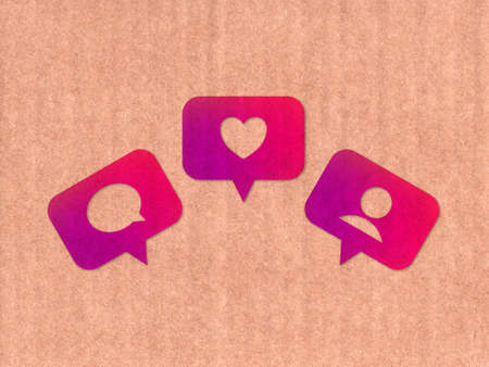 Like, comment, follower icons on cardboard textureの写真素材
