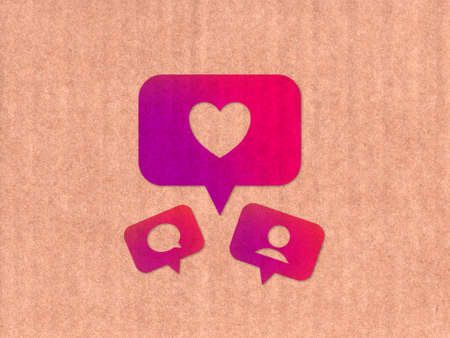 Like, comment, follower icons on cardboard textureの写真素材