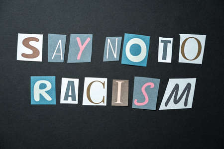 Say no to racism words. Caption, heading made of letters with different fonts on a dark background.の写真素材