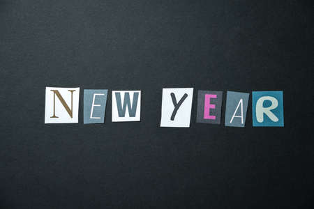 New year words. Caption, heading made of letters with different fonts on a dark background.の写真素材