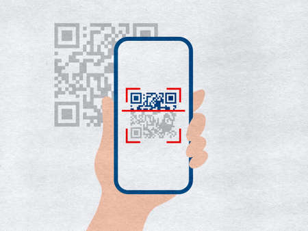 Hand holding smartphone with QR code scannerの写真素材
