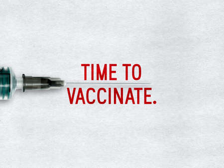 Time to vaccinate - needle and text on paper backgroundの写真素材