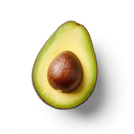 Half of ripe avocado on white background, top view. Vegetarian foodの素材