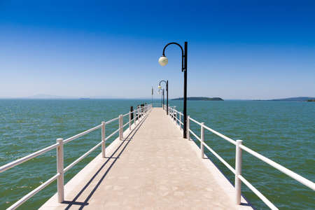Pier on Trasimeno lake near Perugia Italyの写真素材