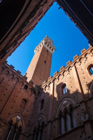 The Torre del Mangia is a tower in Siena, in the Tuscany region of Italyの写真素材