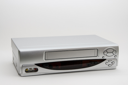 Old VHS video recorder isolated on white background