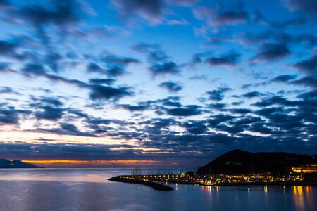 Sunsen in winter on the sea looking at the Piombino channel
