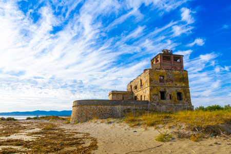 The old coastal salt tower at sunset near Piombino in Tuscany, Italyのeditorial素材