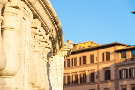 View of historic buildings at sunset in downtown Siena, Italyの写真素材
