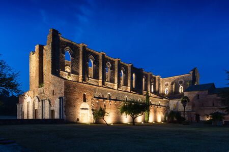 Siena, Italy - August 14: The San Galgano roofless abbey illuminated at sunset in summerのeditorial素材