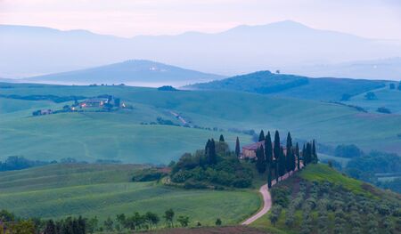 Siena, Italy - May 23, 2019: an iconic landscape in Orcia valley, Tuscany, in spring at sunrise.のeditorial素材