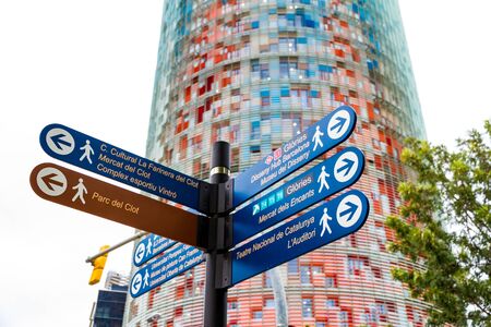 Barcelona, Spain - September 05, 2018: The Torre Glories, formerly known as Torre Agbar and some street signs in Barcelona, Spainのeditorial素材
