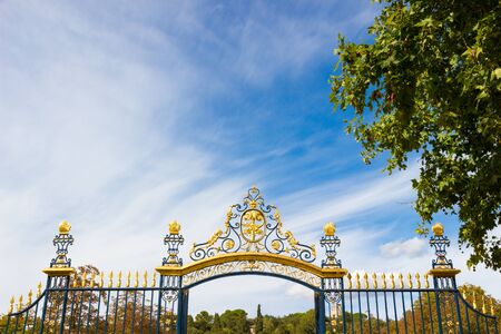 Entrance gate of the Fountain gardens (fountain gardens) of Nimes in southern Franceの写真素材