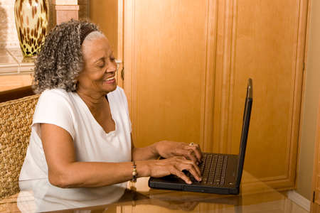 Elderly African American woman working on the computer.の写真素材