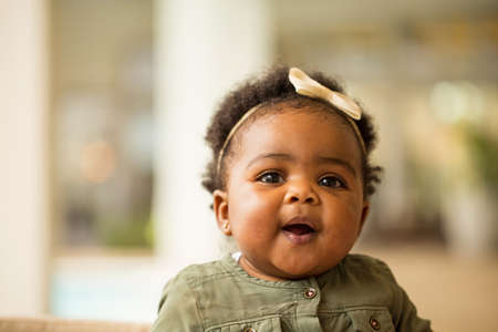Portrait of a happy little girl laughing and smiling.の写真素材