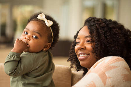 Happy African American mother and her daugher.の写真素材
