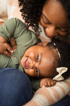 Happy African American mother and her daugher.の写真素材