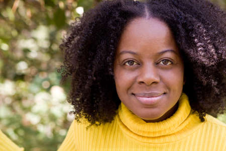 Confident African American woman outside in a garden.の写真素材