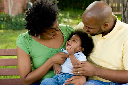 Happy African American family with their baby.の写真素材