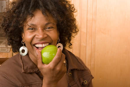 Happy mature African American woman smiling at home.の写真素材